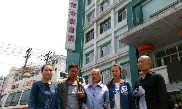 Gao Yixi's family stands outside the Mudanjiang Public Security Hospital on June 9, 2016. (Courtesy of family)