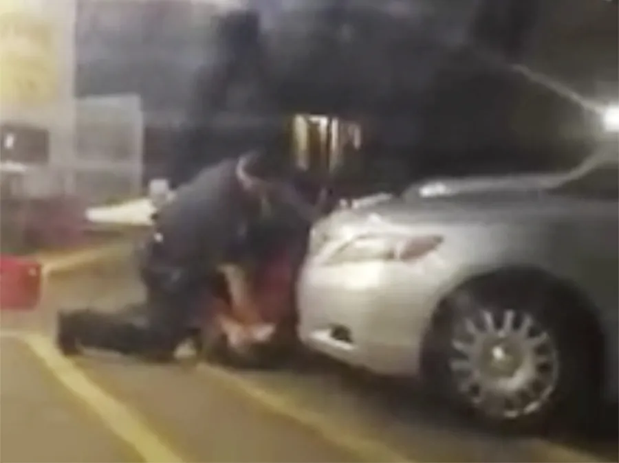 In this Tuesday, July 5, 2016 photo made from video, Alton Sterling is detained by two Baton Rouge police officers outside a convenience store in Baton Rouge, La. Moments later, one of the officers shot and killed Sterling, a black man who had been selling CDs outside the store, while he was on the ground. (Arthur Reed via AP)