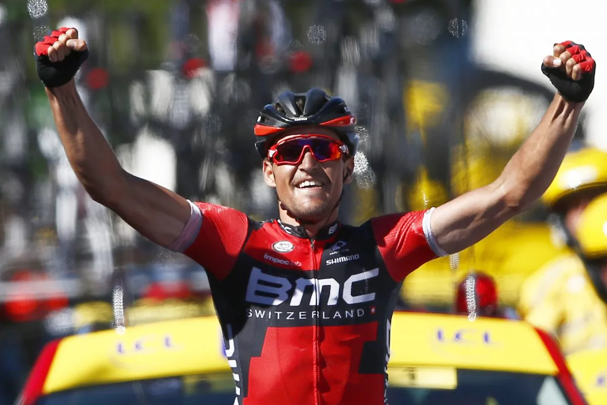 BMC’s Greg van Avermaet celebrates as he crosses the finish line to win the Stage Five and take the overall leader's yellow jersey of the Tour de France cycling race, 216 kilometers (134.2 miles) from Limoges to Le Lioran, France, Wednesday, July 6, 2016. (AP Photo/Peter Dejong)