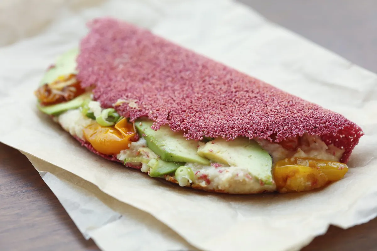 Beet juice-hydrated Tapioca Crepe with avocado, tomato, and cashew cream filling. (Courtesy of Market Ipanema)