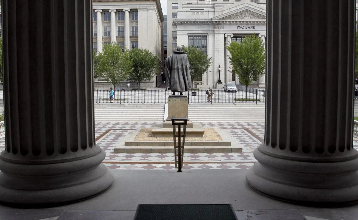 A statue of the Albert Gallatin, the 4th Secretary of the Treasury, stands on the north patio of the U.S. Treasury Building in Washington. (AP Photo/Pablo Martinez Monsivais)