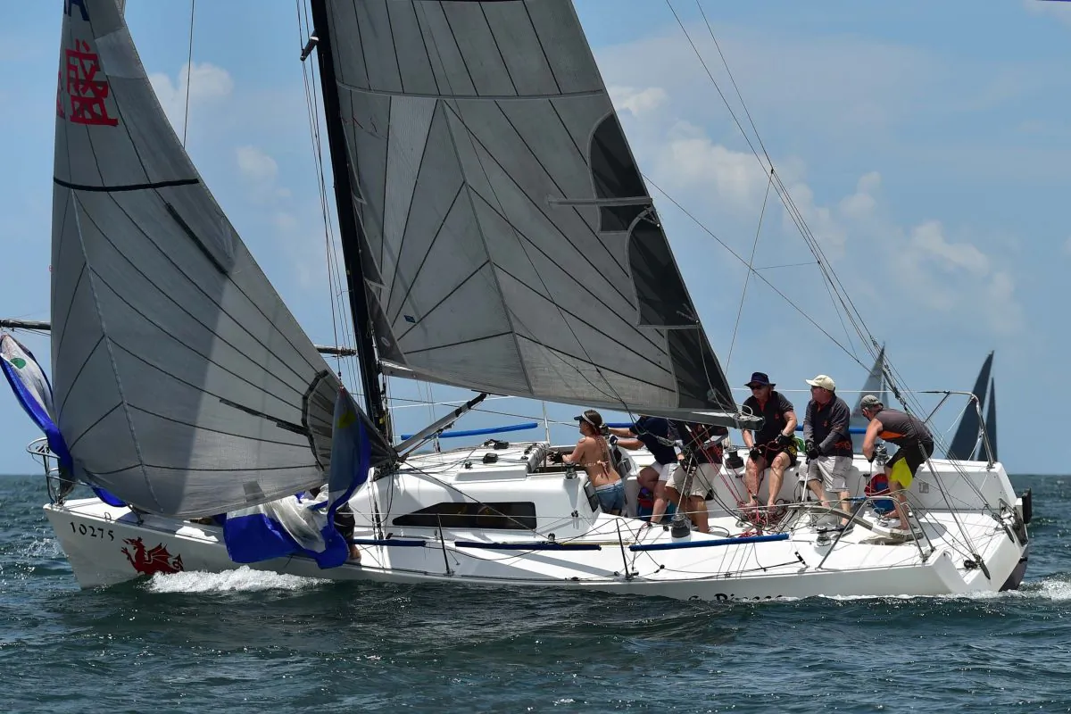 Toby Jenkyn-Jones, owner, skipper of ‘Bits and Pieces” shows his skill rounding the Bay Mark in race 4 of the 2016 Hebe Haven Typhoon Series on Sunday July 3, 2016. Bit and Pieces took line honours and 1st place on corrected time in the race. (Bill Cox/Epoch Times)