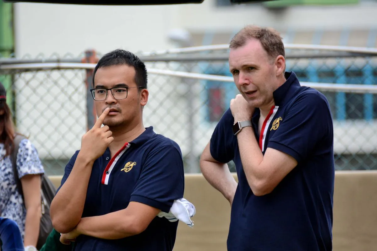 Robin Chok (left) and Derek Wyllie considering their tactics during the National Pairs final 2016 against CCC’s Imen Tang and Stanley Lai.  Chok and Wyllie lost the game by one shot and have to settle for runners-up. (Stephanie Worth)