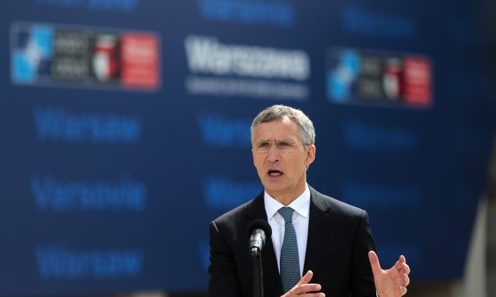 NATO Secretary General Jens Stoltenberg briefs the media prior to the NATO summit in Warsaw, Poland, Friday, July 8, 2016. Starting Friday, US President Barack Obama and leaders of the 27 other NATO countries will take decisions in Warsaw on how to deal with a resurgent Russia, violent extremist organizations like Islamic State, attacks in cyberspace and other menaces to allies' security during a summit described by many observers as NATO's most crucial meeting since the 1989 fall of the Berlin Wall.(AP Photo/Markus Schreiber)