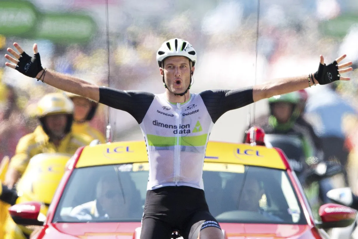 Dimension Data’s Stephen Cummings crosses the finish line to win Stage Seven of the 2016 Tour de France, 162.5 kilometers (100.7 miles) from L'Isle-Jourdain to Lac de Payolle, France, Friday, July 8, 2016. (AP Photo/Peter Dejong)