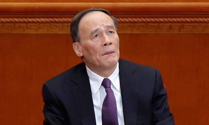 Secretary of the Central Commission for Discipline Inspection Wang Qishan attends the closing session of the Chinese People's Political Consultative Conference at the Great Hall of the People on Mar. 13, 2015 (Feng Li/Getty Images)