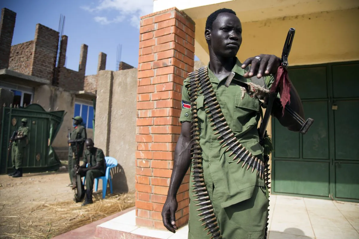 A member of the Sudan People's Liberation Army in Opposition (SPLA-IO) stand guard at the military site in Juba, after the arrival of new troops and their chief of staff on April 25, 2016. (Albert Gonzalez Farran/AFP/Getty Images)