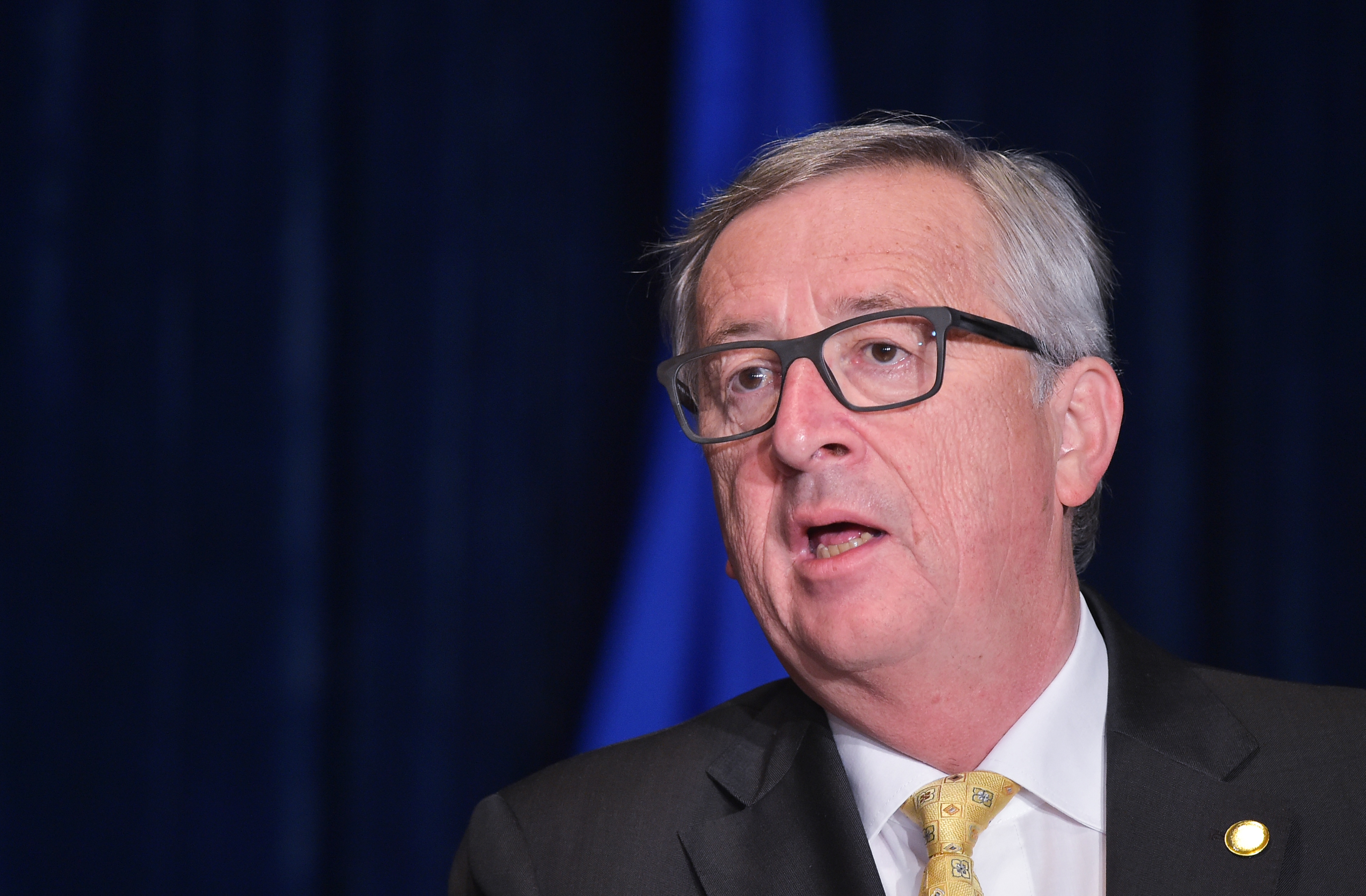 European Commission President Jean-Claude Juncker speaks during the joint press statements on the sidelines of the NATO Summit at a hotel in Warsaw, Poland, on July 8, 2016. (Mandel Ngan/AFP/Getty Images)