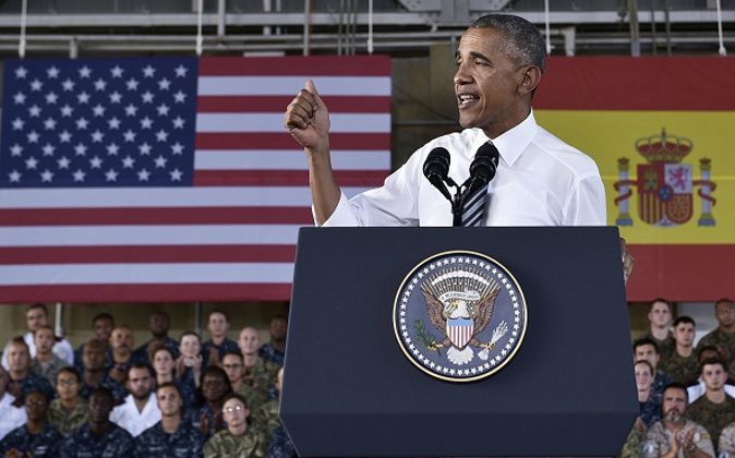 US President Barack Obama speaks to service members at the Naval Station Rota, in Rota, southwestern Spain on July 10, 2016. Obama said he will cut short a foreign trip and visit Dallas next week as the shooting rampage by the black army veteran, who said he wanted to kill white cops, triggered urgent calls to mend troubled race relations in the United States. / AFP / MANDEL NGAN (Photo credit should read MANDEL NGAN/AFP/Getty Images)