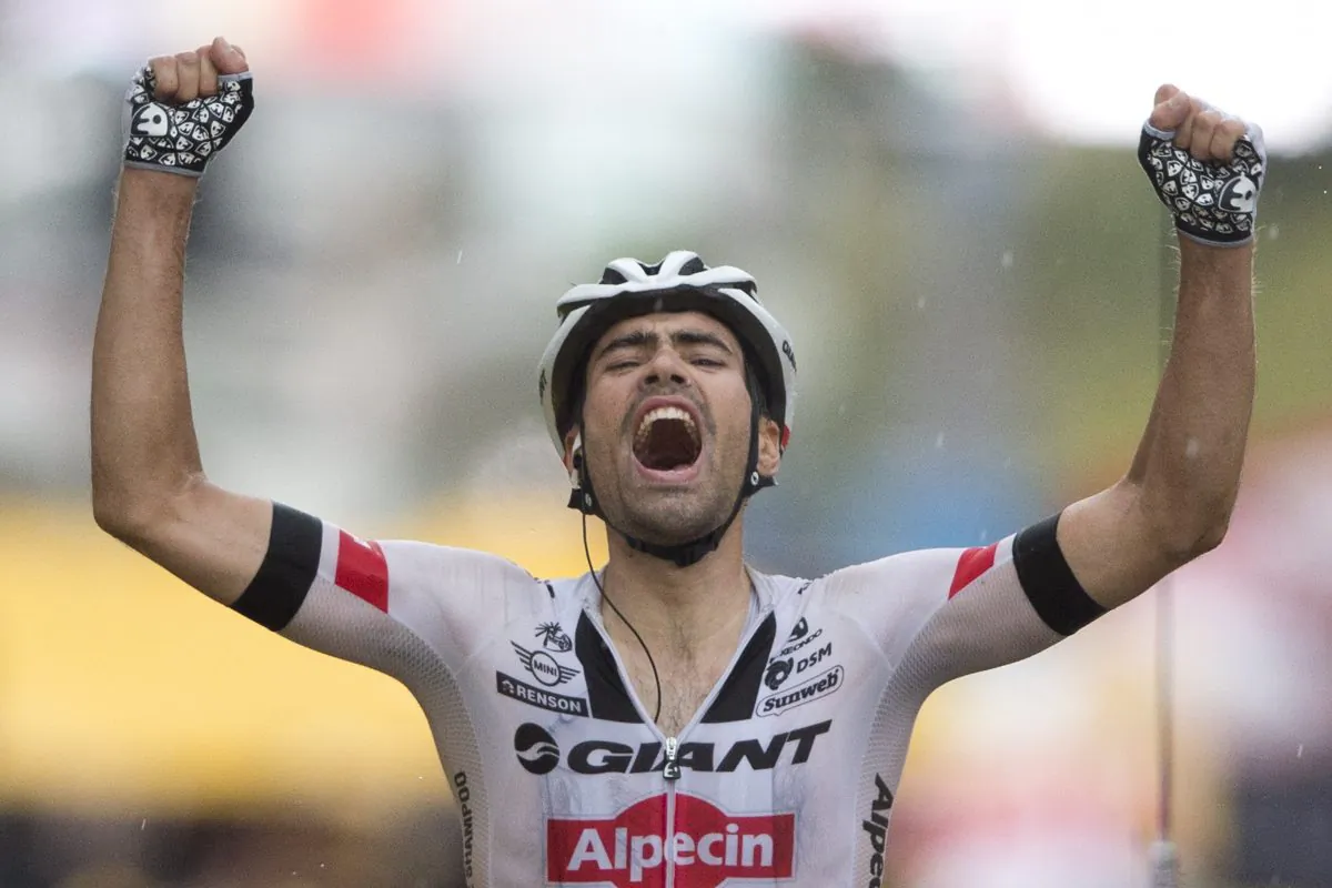 Giant Alpecin’s Tom Dumoulin celebrates as he crosses the finish line to win Stage Nine of the 2016 Tour de France, 184.5 kilometers (114.3 miles) from Vielha Val d'Aran, Spain, to Andorra Arcalis, Andorra, Sunday, July 10, 2016. (AP Photo/Peter Dejong)