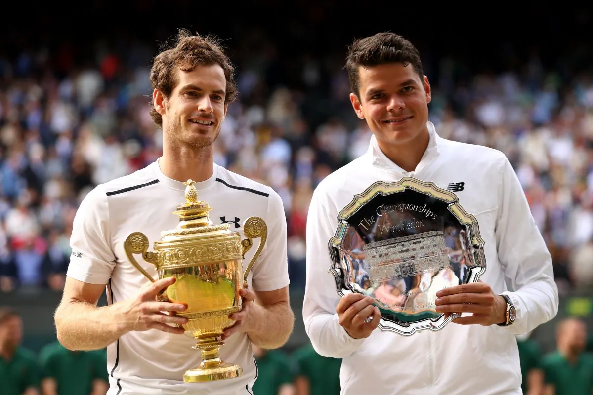 Andy Murray and Milos Raonic hold their trophies after the men’s final on July 10, 2016 in London, England. Murray won his second Wimbledon title against the Canadian playing in his first major final. (Julian Finney/Getty Images)