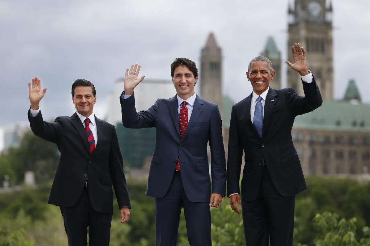 (L-R) Mexican President Enrique Pena Nieto, Canadian Prime Minister Justin Trudeau, and U.S. President Barack Obama pose for a group photo with Canada's Parliament Hill in the background during the North American Leaders Summit in Ottawa, Ontario, on June 29, 2016. (Chris Roussakis/AFP/Getty Images)