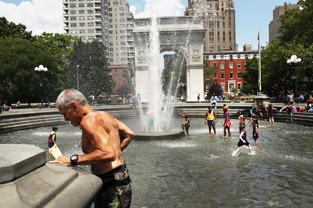 An elderly man cools off by a fountain in Washington Square Park on July 6, 2016, in New York City. New York City and much of the Northeast is experiencing the real heat of the summer with temperatures in the 90's. (Spencer Platt/Getty Images)