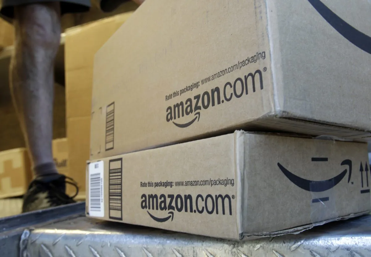 FILE - In this June 30, 2011 file photo, a United Parcel Service driver delivers packages from Amazon.com in Palo Alto, Calif. Amazon is offering deals July 12, 2016, for the second edition of its annual "Prime Day" promotion. (AP Photo/Paul Sakuma, File)