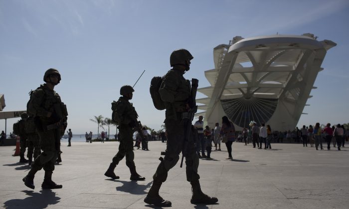 Soldiers patrol outside the Museum of Tomorrow in Rio de Janeiro, Brazil, July 9, 2016. (AP Photo/Leo Correa)