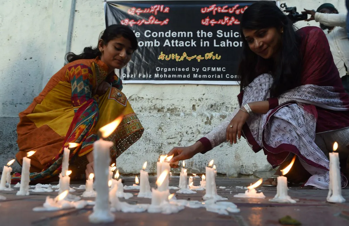 Pakistani residents light candles after a Taliban suicide bomber targeting Christians killed 72 people including many children on March 27, 2016. (ASIF HASSAN/AFP/Getty Images)
