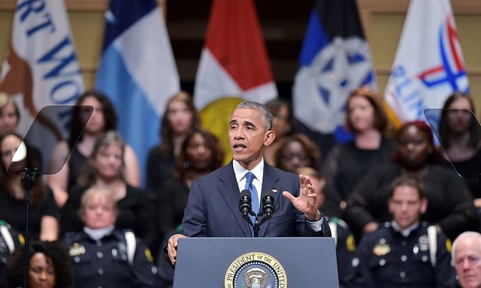 US President Barack Obama speaks during an interfaith memorial service for the victims of the Dallas police shooting at the Morton H. Meyerson Symphony Center on July 12, 2016 in Dallas, Texas.
President Barack Obama attended a somber memorial Tuesday to five police officers slain in a sniper ambush in Dallas, as he seeks to unify a country divided by race and politics. / AFP / Mandel NGAN        (Photo credit should read MANDEL NGAN/AFP/Getty Images)