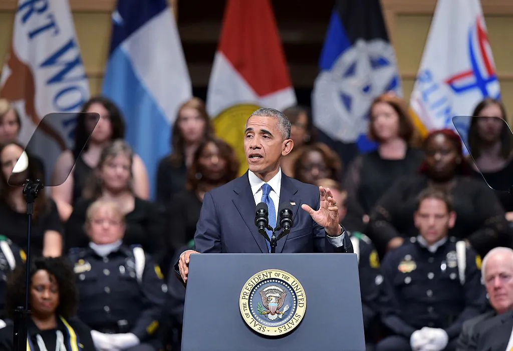 US President Barack Obama speaks during an interfaith memorial service for the victims of the Dallas police shooting at the Morton H. Meyerson Symphony Center on July 12, 2016 in Dallas, Texas.
President Barack Obama attended a somber memorial Tuesday to five police officers slain in a sniper ambush in Dallas, as he seeks to unify a country divided by race and politics. / AFP / Mandel NGAN        (Photo credit should read MANDEL NGAN/AFP/Getty Images)