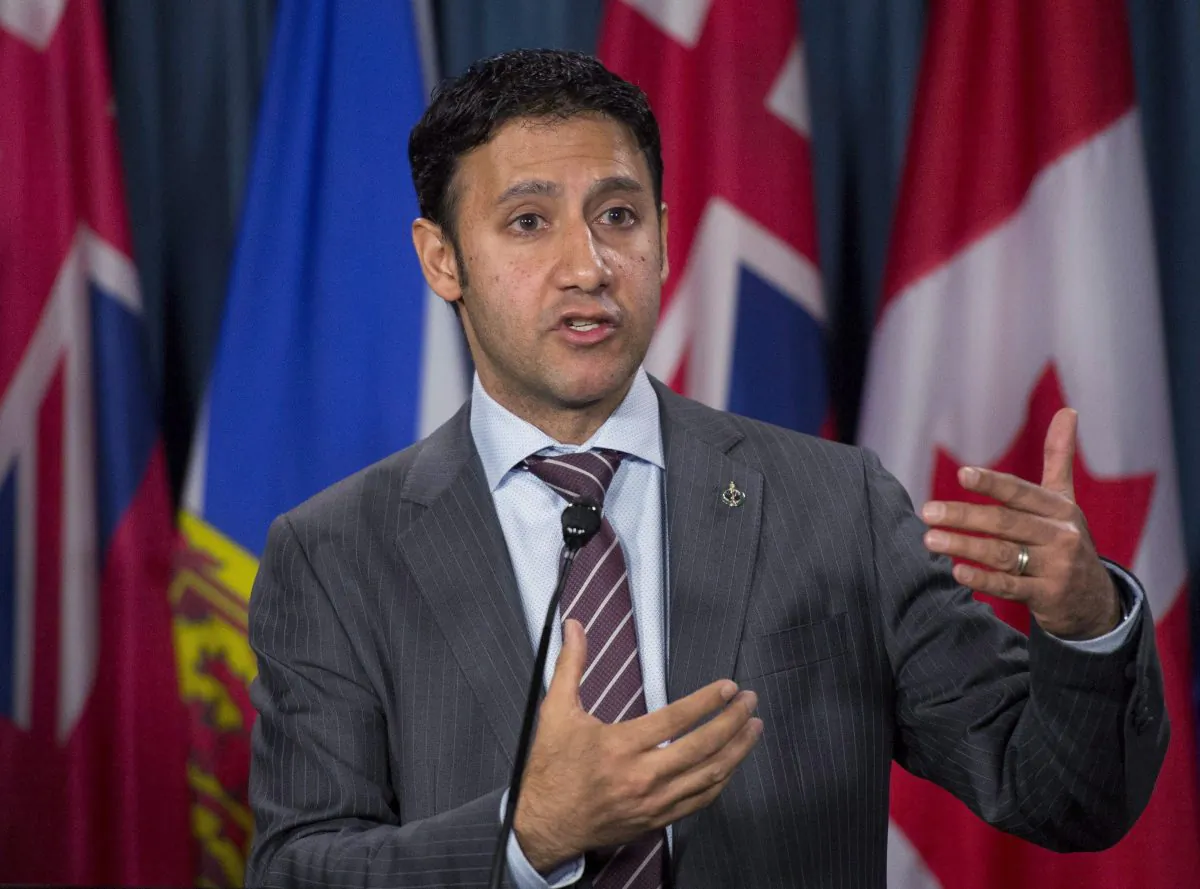 Parliamentary Secretary to the Minister of Immigration, Refugees and Citizenship Arif Virani speaks during a press conference on Parliament Hill in Ottawa on Dec. 10, 2015. (The Canadian Press/Justin Tang)