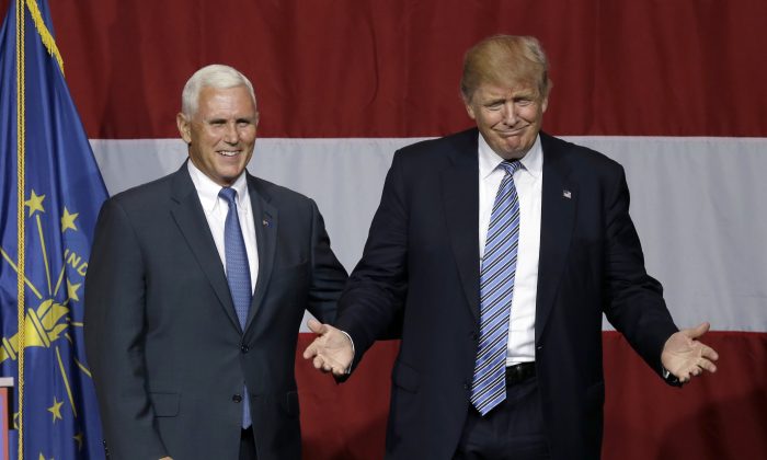 Indiana Gov. Mike Pence joins Republican presidential candidate Donald Trump at a rally in Westfield, Ind., on July 12, 2016. (AP Photo/Michael Conroy)