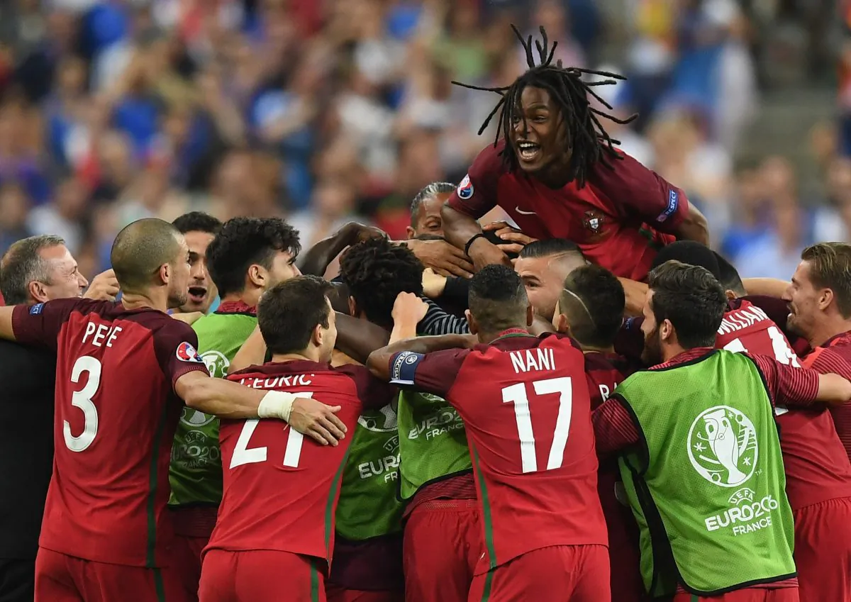 Renato Sanches (top) and Portugal players celebrate their team's first goal scored by Eder (obscured) during the UEFA EURO 2016 Final match between Portugal and France at Stade de France on July 10 in Paris, France. (Laurence Griffiths/Getty Images)