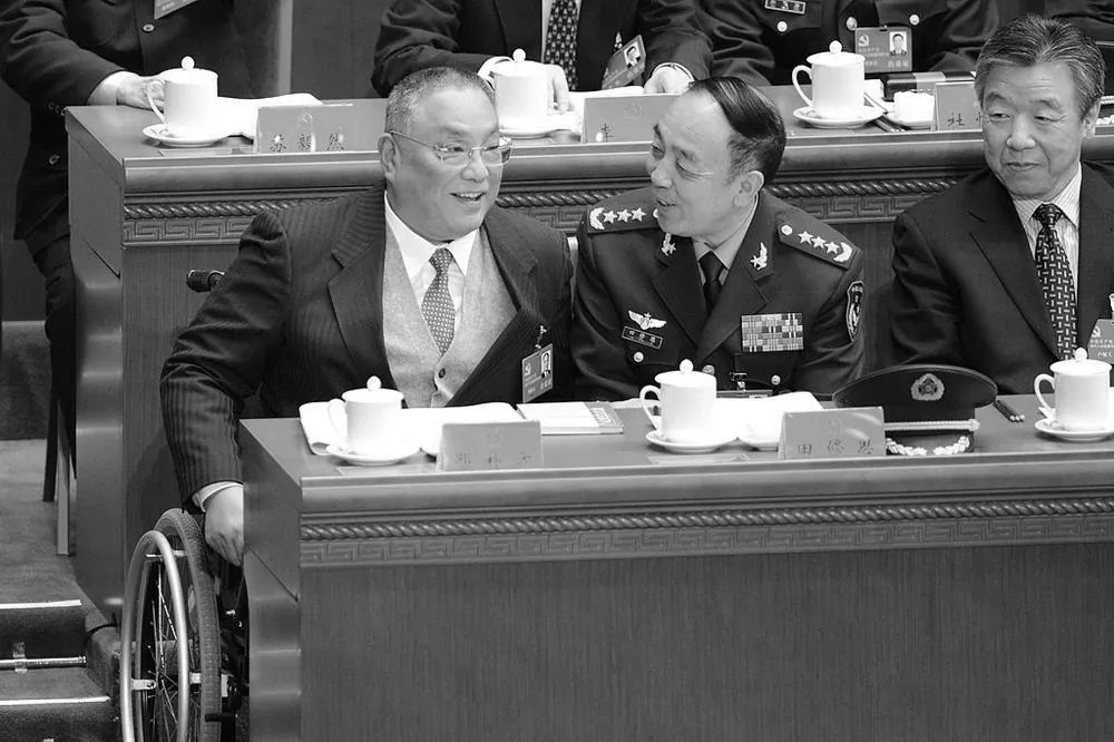 Deng Xiaoping's son (L) Deng Pufang talks to general Tian Xiusi at Great Hall of the People on Nov. 8, 2012. Tian has recently been placed under investigation for violation of Party discipline. (Goh Chai Hin/AFP/Getty Images)