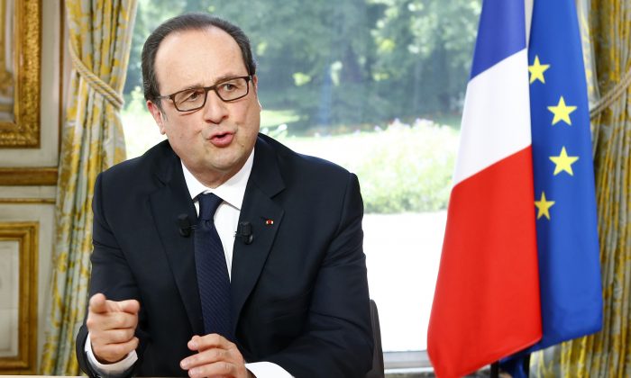 French President Francois Hollande gestures  after a televised interview following the Bastille Day Parade in Paris, Thursday, July 14, 2016 at the Elysee Palace. (AP Photo/Francois Mori, Pool)