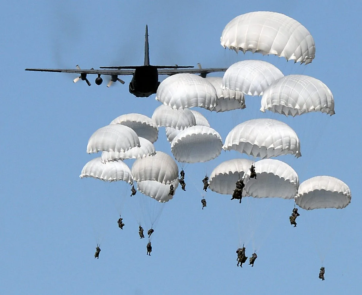 Polish troops land with parachutes at the military compound near Torun, Poland, on June 7, 2016, as part of the NATO Anaconda-16 military exercise.  (Janek Skarzynski/AFP/Getty Images)