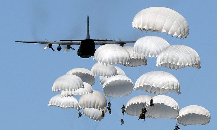 Polish troops land with parachutes at the military compound near Torun, Poland, on June 7, 2016, as part of the NATO Anaconda-16 military exercise.  (Janek Skarzynski/AFP/Getty Images)