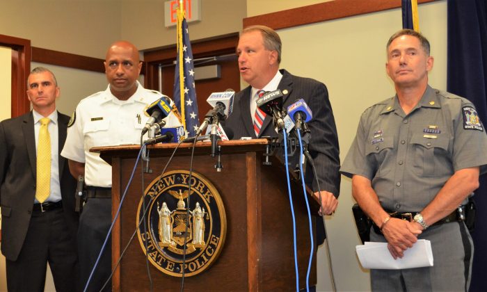 (L-R) Lt. John Ewanciw, Chief Ramon Bethencourt, District Attorney David Hoovler, and Major Joseph Tripolo at press conference at Troop F State Police headquarters in Middletown on July 13, 2015. (Yvonne Marcotte/Epoch Times)