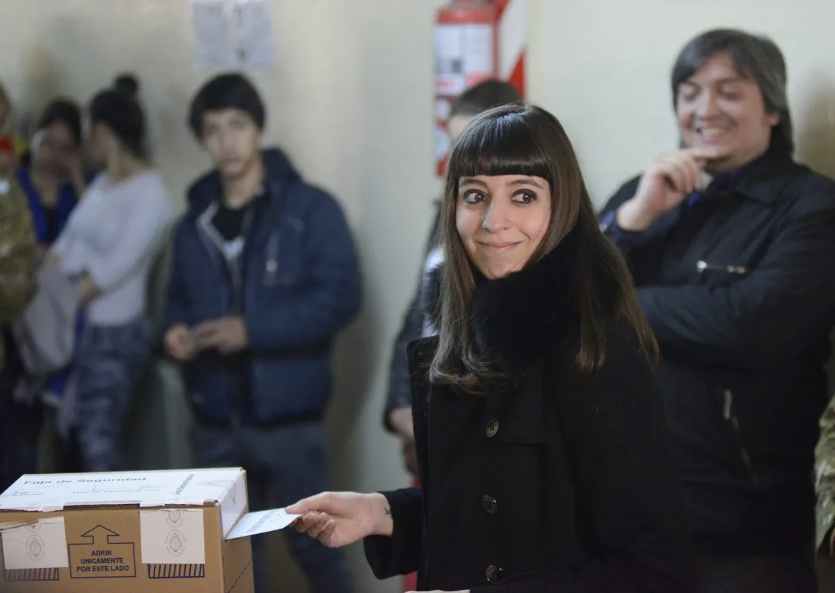 Florencia Kirchner, daughter of Argentina's former President Cristina Fernandez, casts her vote during elections in Rio Gallegos, Argentina, on Oct. 25, 2015. An Argentine prosecutor asked on Friday, July 15, 2016, a local court to seize the more than $4.6 million from the bank safe deposit boxes belonging to the 26-year-old Kirchner, as part of an investigation into alleged money laundering. (AP Photo/Francisco Munoz, File)