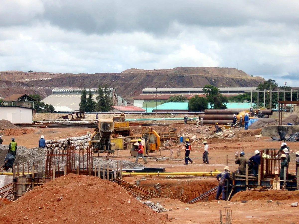 Zambian workers constructing a new $300 million copper smelter in Chingola, Zambia, on top of some of the richest copper deposits in the world, on Dec. 13, 2006. (AP Photo/Joseph Schatz)