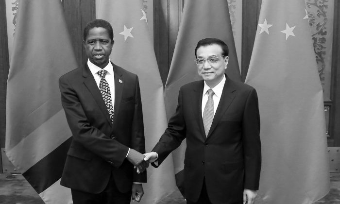 Chinese Premier Li Keqiang (R) shakes hands with Zambia's President Edgar Chagwa Lungu at the Great Hall of the People in Beijing, China, on March 30, 2015. (Feng Li/Getty Images)