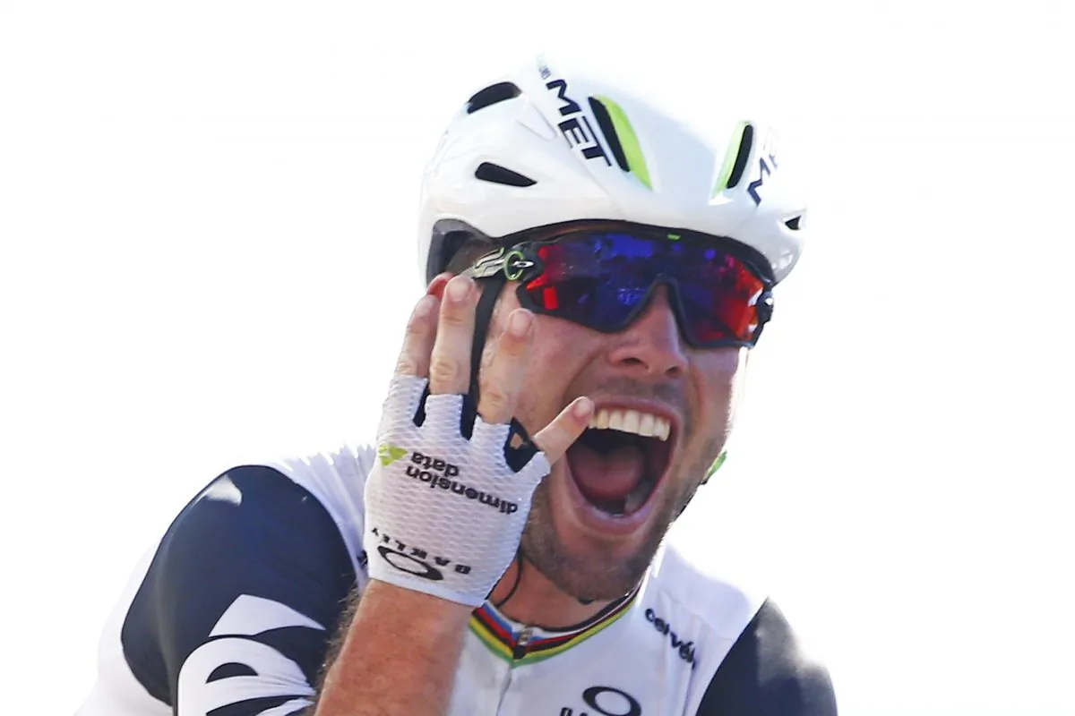 Dimension Data's Mark Cavendish flashes four fingers for his fourth victory in this year's Tour de France as he crosses the finish line to win Stage 14, 208.5 kilometers (129.2 miles) from Montelimar to Villars-les-Dombes, France, Saturday, July 16, 2016. (AP Photo/Peter Dejong)
