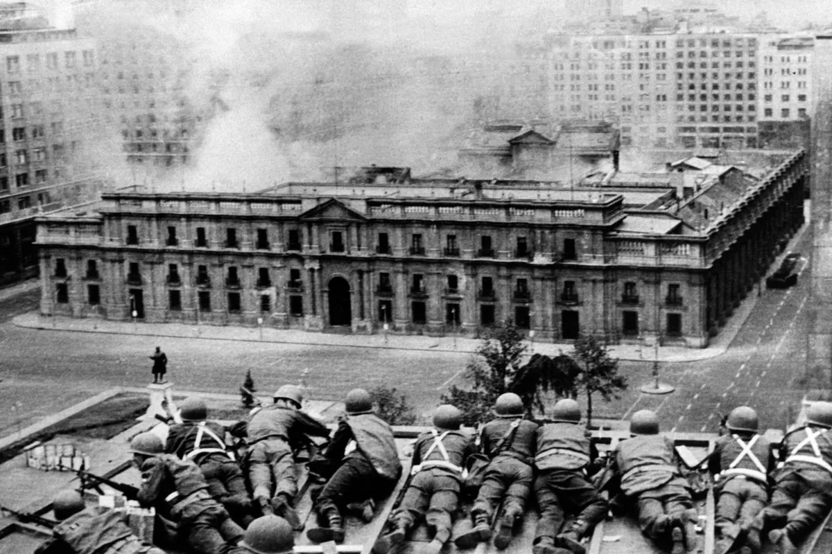 Chilean Army troops positioned on a rooftop fire on the La Moneda Palace in Santiago on Sept. 11, 1973, during the military coup led by General Augusto Pinochet which overthrew Chilean president Salvador Allende, who died in the attack on the palace. (OFF/AFP/Getty Images)