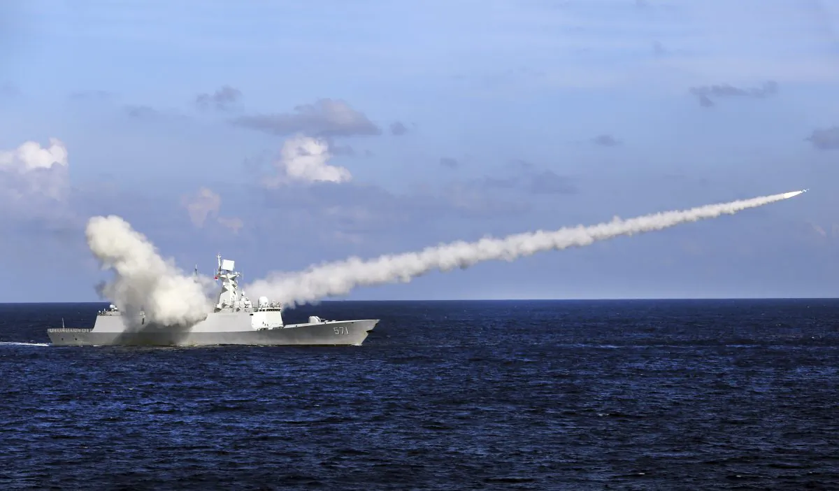 A Chinese missile frigate Yuncheng launches an anti-ship missile during a military exercise in the waters near south China's Hainan Island and Paracel Islands on July 8, 2016. (Zha Chunming/Xinhua via AP)