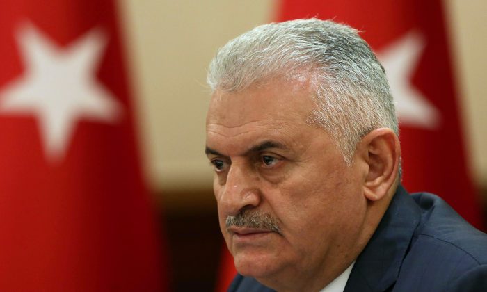 Turkey's Prime Minister Binali Yildirim speaks in tears after a weekly cabinet meeting in Ankara, Turkey, Monday, July 18, 2016. Following a failed coup against Turkish President Recep Tayyip Erdogan, his government moved swiftly to shore up his power and remove those perceived as an enemy, saying it has detained 6,000 people. (Hakan Goktepe, Prime Ministry Press Service, Pool)