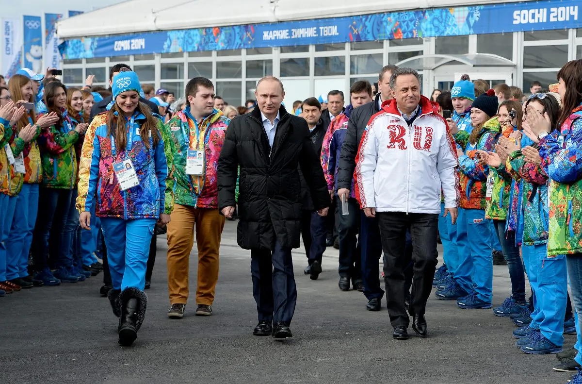 FILE - In this Feb. 5, 2014 file photo Russian President Vladimir Putin, center, visits the Olympic Athletes Village in Coastal Cluster ahead of the Sochi 2014 Winter Olympics with Olympic Village Mayor Elena Isinbaeva, left, and Russian Minister of Sport, Tourism and Youth policy Vitaly Mutko in Sochi, Russia. On Monday, July 18, 2016 WADA investigator Richard McLaren confirmed claims of state-run doping in Russia. (Pascal Le Segretain/Pool Photo via AP, file)