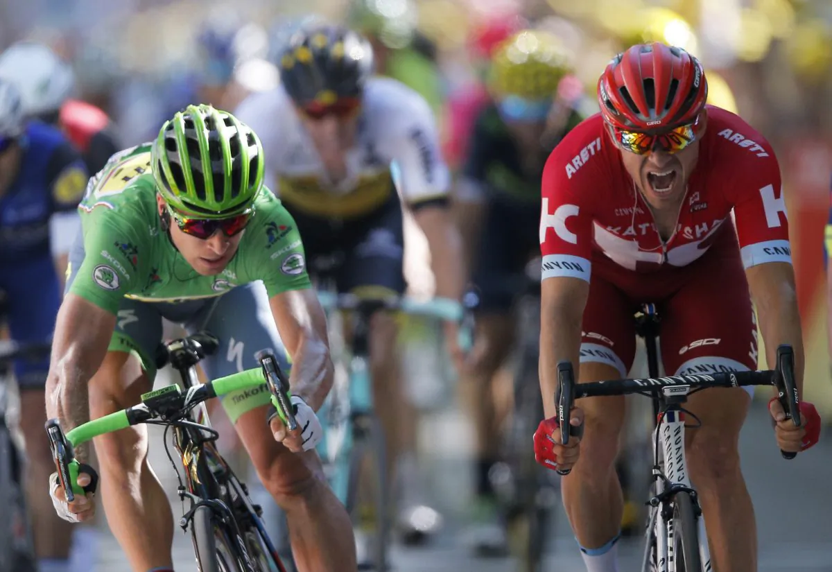 Peter Sagan Tinkoff, wearing the best sprinter's green jersey, crosses the finish line ahead of Katusha’s Alexander Kristoff to win Stage 16 of the 2016 Tour de France, 209 kilometers (129.9 miles) from Moirans-en-Montagne to Bern, Switzerland, Monday, July 18, 2016. (AP Photo/Christophe Ena)