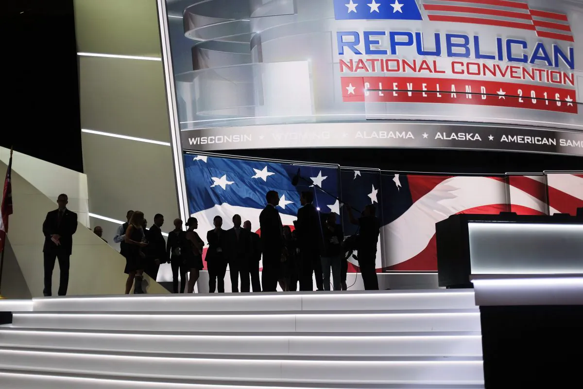 People watch an interview being filmed onstage on the second day of the Republican National Convention on July 19, 2016, in Cleveland, Ohio. (DOMINICK REUTER/AFP/Getty Images)