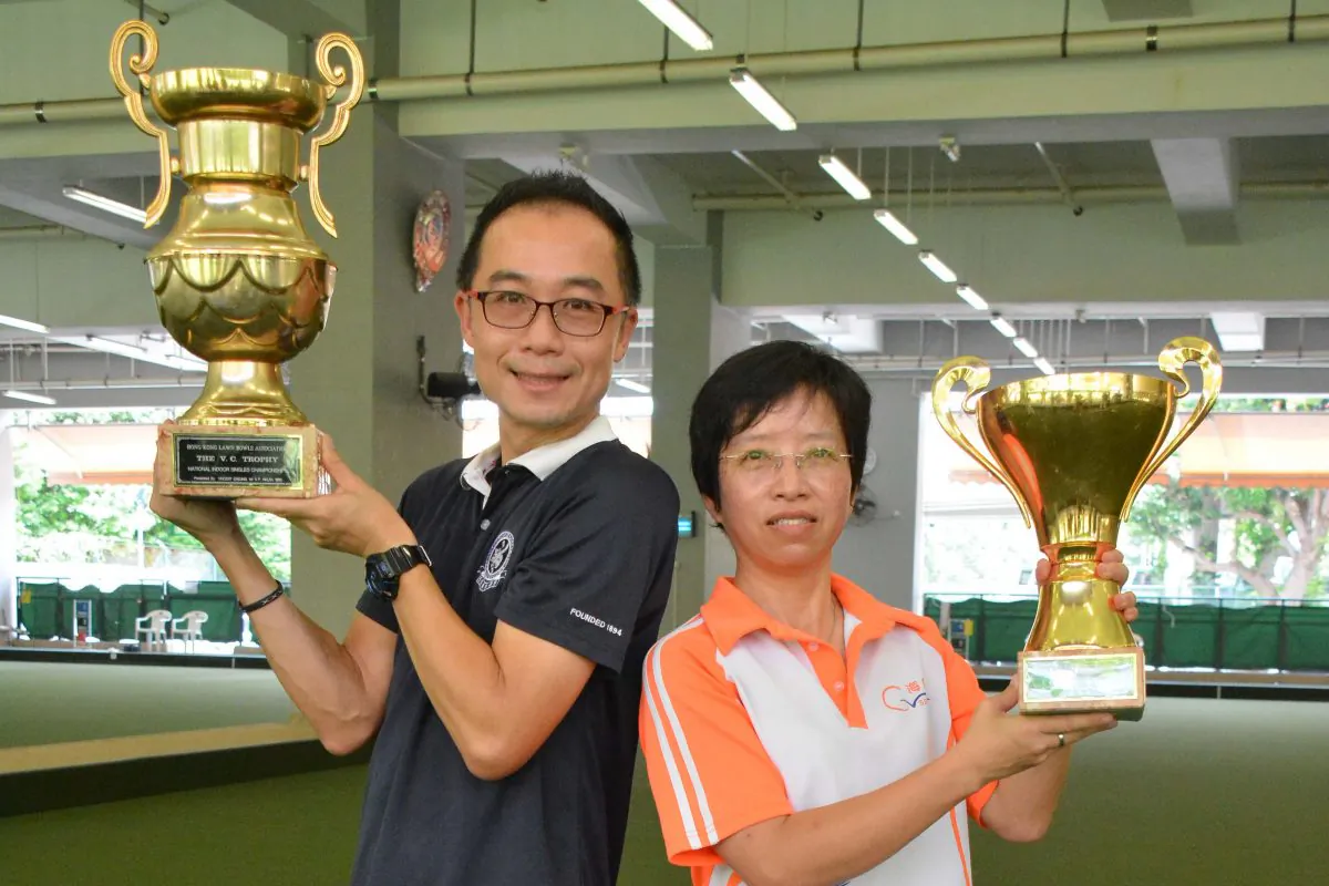 Stanley Lai and Queenie Lai display their trophies after winning the Indoor Singles Finals, at Club de Recreio on Saturday July 16, 2016. (Stephanie Worth)