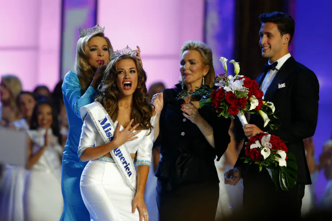 In this Sept. 13, 2015, file photo, Miss America 2015 Kira Kazantsev crowns Miss Georgia Betty Cantrell as Miss America 2016 in Atlantic City, N.J. (AP Photo/Noah K. Murray, File)