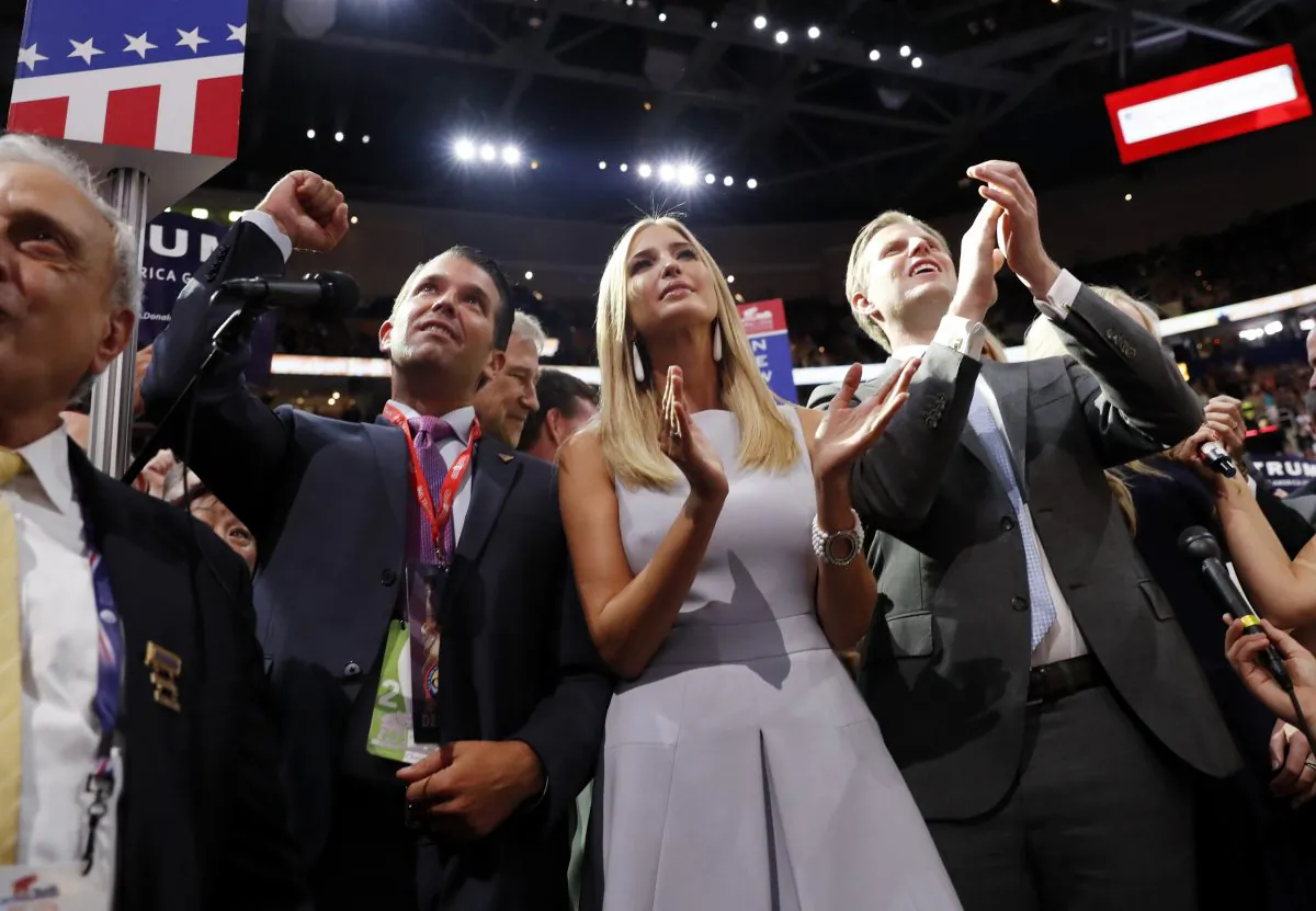 Republican Presidential Candidate Donald Trump's children Donald Trump, Jr., Ivanka Trump, and Eric Trump celebrate on the convention floor during the second day session of the Republican National Convention in Cleveland, Tuesday, July 19, 2016. (AP Photo/Carolyn Kaster)