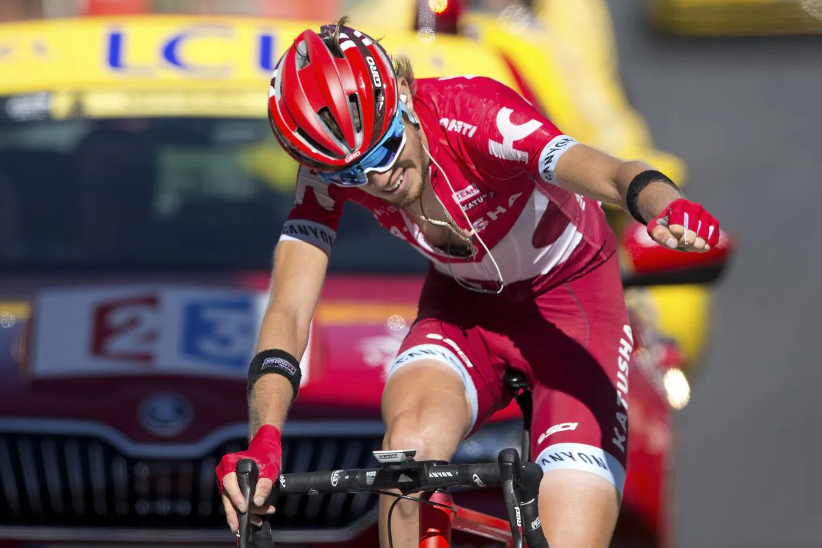Katusha's Ilnur Zakarin celebrates as he crosses the finish line to win Stage 17 of the Tour de France, 184.5 kilometers (114.3 miles) from Bern to Finhaut-Emosson, Switzerland, Wednesday, July 20, 2016. (AP Photo/Peter Dejong)