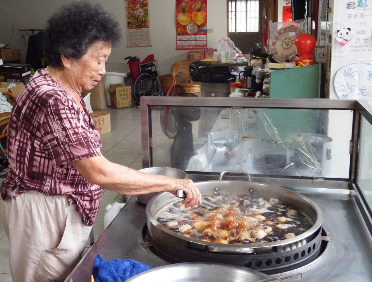 Jin-pen Tsau cooks a batch of tea eggs in her kitchen at Sun Moon Lake, Taiwan. (Photo by Monica Frim)