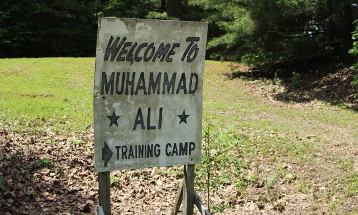 FILE - In this June 6, 2016, file photo, a sign is displayed outside Muhammad Ali's training camp in Deer Lake, Pa. The son of NFL Hall of Fame coach John Madden is buying Muhammad Ali's former training camp in Pennsylvania. The camp's longtime owner, martial arts instructor George Dillman, tells The Associated Press he has sold the rustic hilltop camp in Deer Lake to Mike Madden. He says the deal is closing Thursday, July 31, 2016. (AP Photo/Michael Rubinkam, File)