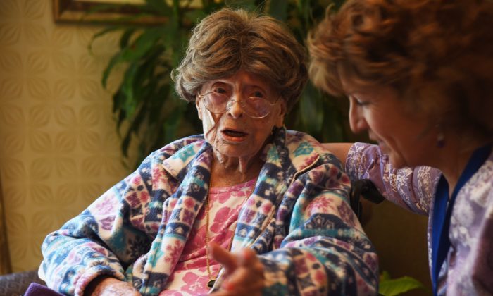 In this July 19, 2016, photo, Adele Dunlap, 113, talks with Susan Dempster, the Activities Director at Country Arch Care Center in Pittstown, N.J. (Chris Pedota/The Record of Bergen County via AP)