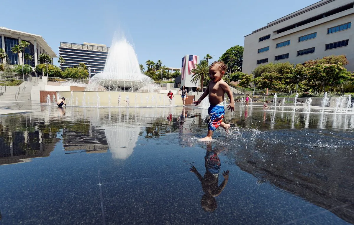 Ali Zenaidi, 2, cools off in the Arthur J. Will Memorial Fountain inside Grand Park during a major heat wave in Southern California in downtown Los Angeles, California in this file photo. (Kevork Djansezian/Getty Images)