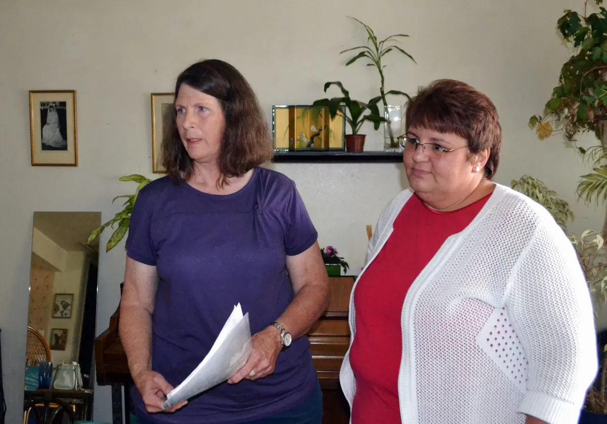 Susan Shirley, left, stands next to a family friend as she talks to the Associated Press, Thursday, July 21, 2016, in Arvada in suburban Denver. Susan Shirley said the U.S. Consulate in Turkey called her Tuesday to tell her that her son Levi Shirley, 24, was killed July 14 by a land mine. Levi Shirley joined Kurdish forces in their fight against the Islamic State group was killed in combat in Syria. (AP Photo/P. Solomon Banda)
