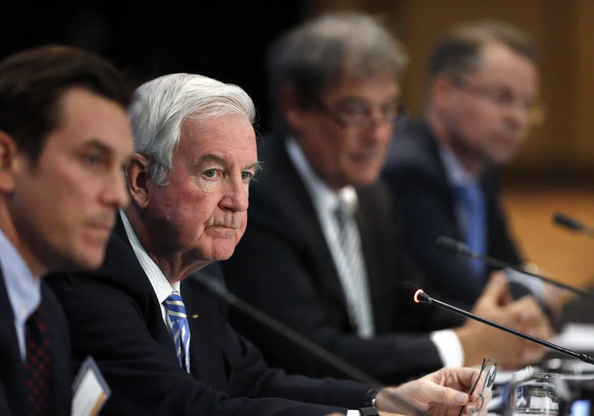 Craig Reedie (2L), president of the World Anti-Doping Agency (WADA), listens to a question during a news conference following a meeting in which WADA leadership voted to declare Russia's anti-doping operation out of compliance, in Colorado Springs, Colo., on Nov. 18, 2015. (AP Photo/Brennan Linsley)